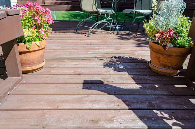 Worn out deck boards before staining.