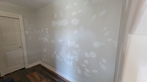 Spots patched and primed on a wall before painting in omaha, NE.