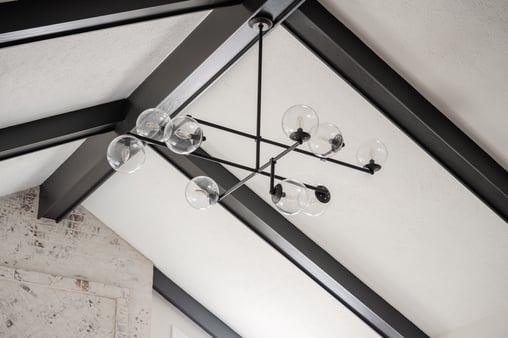 Ceiling painted white with black wood molding lines.