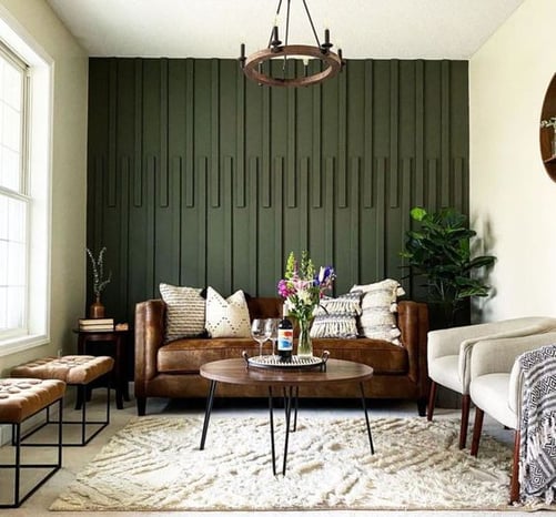 Living room with dark green accent wall