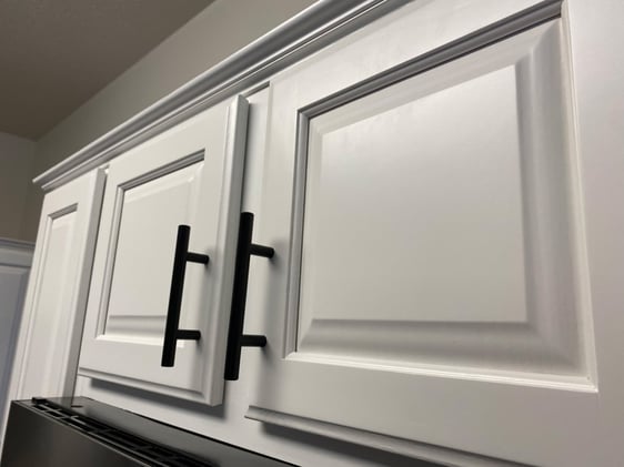 White painted cabinet doors with black handles in omaha, NE.