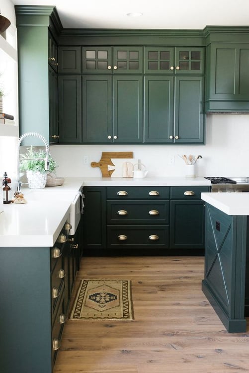 Kitchen with dark green cabinets