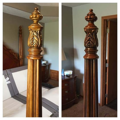 Bed posts stained a dark brown color inside a room in Omaha, NE.