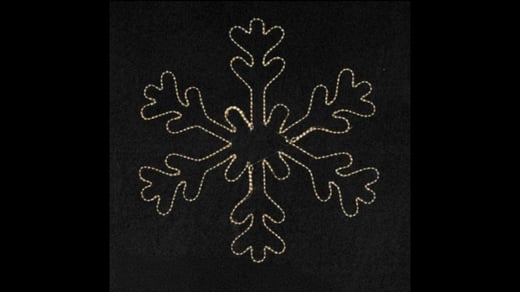 Snowflake light for christmas lights on the outside of a house.