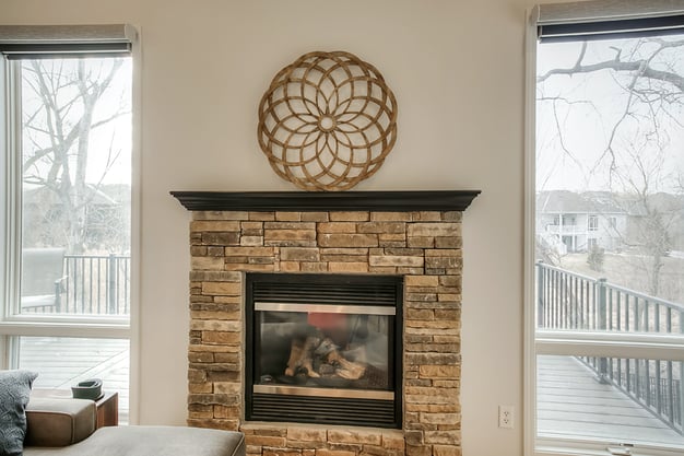 interior fireplace with natural colored stone.