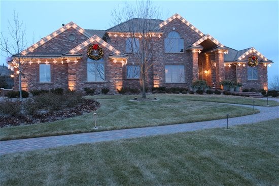 Professionally installed christmas lights on the roofline of a house in Omaha, NE.