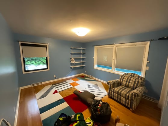 Before interior painting a bedroom with blue paint and white trim.