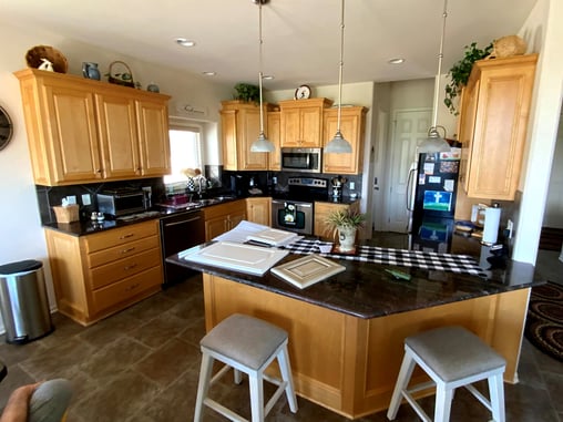 Oak cabinets with off white walls