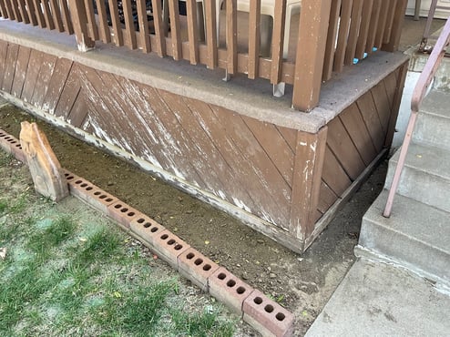 Scratched and damage dark wood stained back deck in omaha.