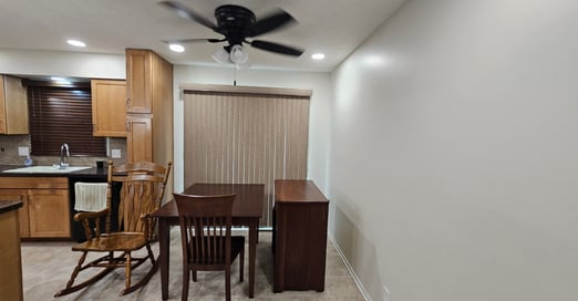Omaha home kitchen and dining room with white walls and ceiling freshly painted.