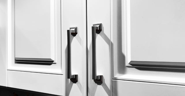 White thermofoil kitchen cabinets inside of a home in Omaha, NE.