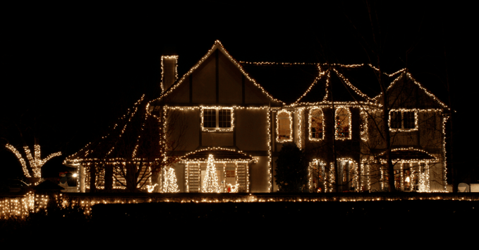 Christmas lights along the roofline, windows, doors, and corners of a home in Omaha, Nebraska.