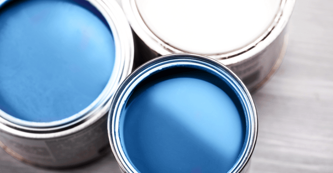 Blue paint inside of two gallons.