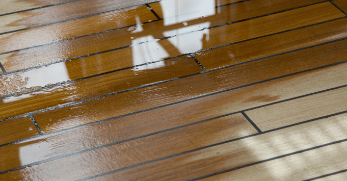 Water on wooden deck outside of a home in Omaha, NE.
