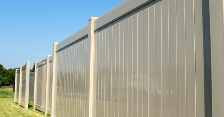 Large composite privacy fence in a tan color in Omaha, NE.
