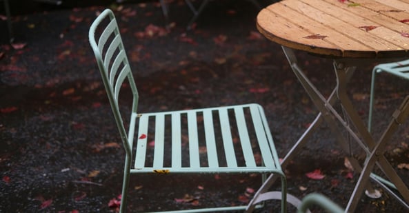 Outdoor metal chair painted light green.