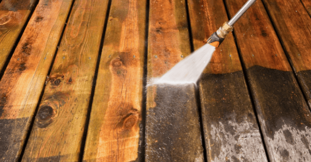 Stained deck being power washed in Omaha, NE.