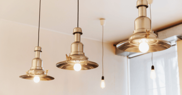 Lighting fixtures in kitchen in a home with open light bulbs.