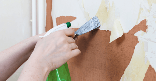 Wallpaper peeling off a wall.