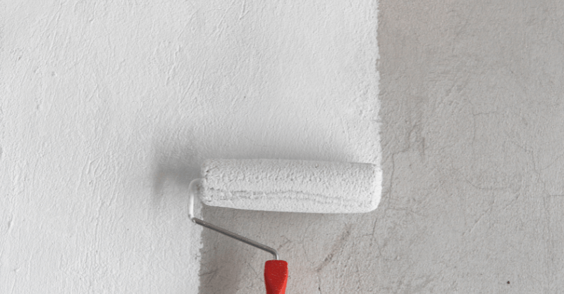 White paint being rolled onto a wall inside or outside of a home in Omaha, NE.