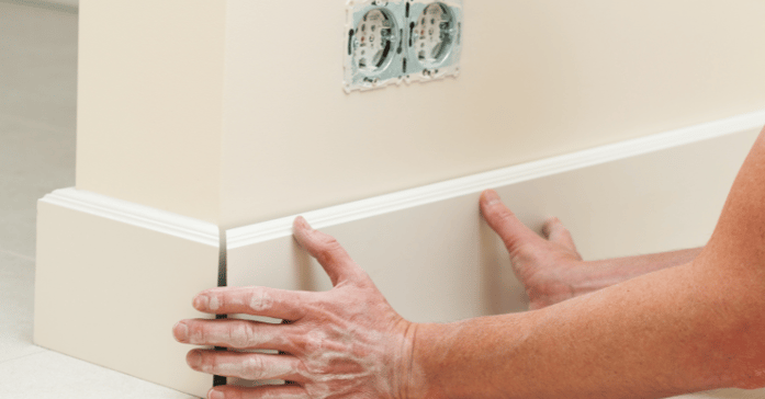 Gaps in interior wood trim in a room.