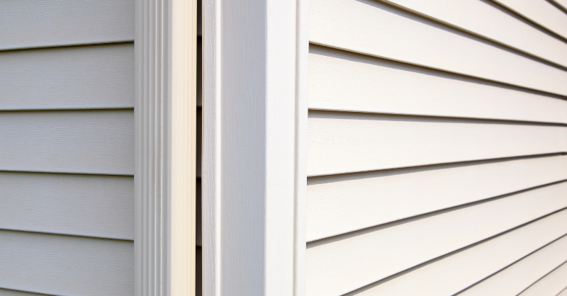 Off white, beige vinyl siding on a house that needs painted in Omaha, NE.
