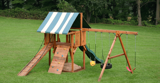 Playset stained a light warm brown color in a yard in Omaha.