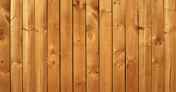 Fence stained natural wood color.