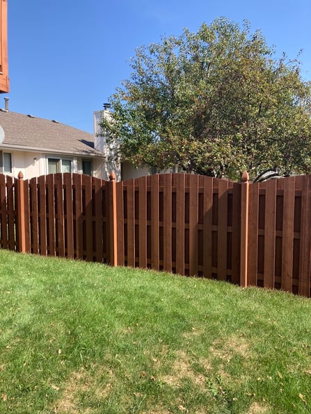 Medium brown color stained fence in Omaha, NE.