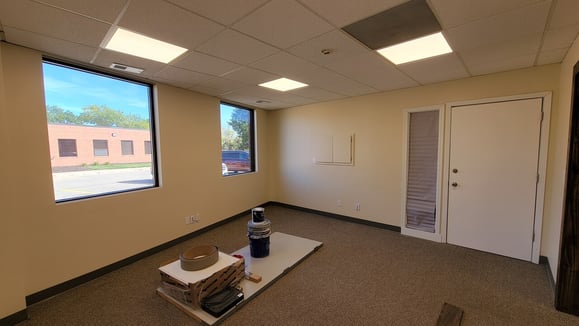 Office interior walls painted white.