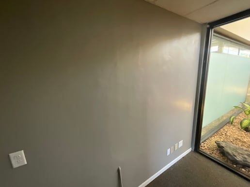 Room with flashing paint on the wall before repainting.