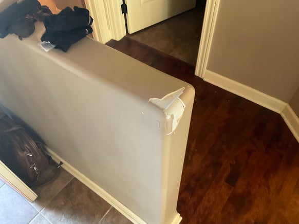 Entryway ledge that needs some drywall repairs before painting.