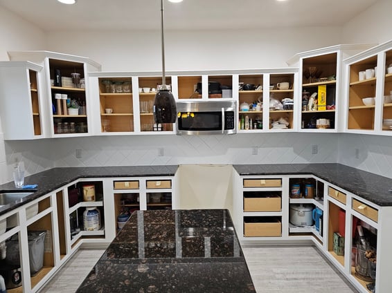 Kitchen cabinets with doors removed and painted white in Omaha, NE.