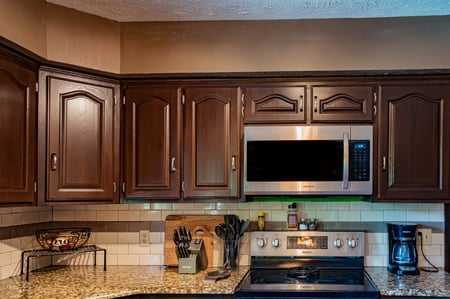 Dark brown upper kitchen cabinets