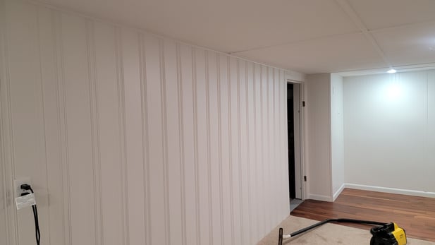 Interior walls painted white on shiplap