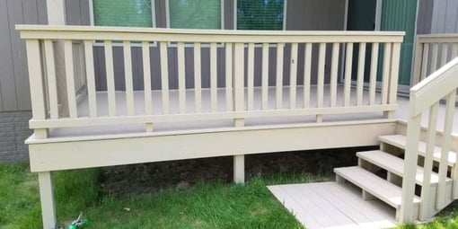 Deck that has been stained with a solid-color, white.