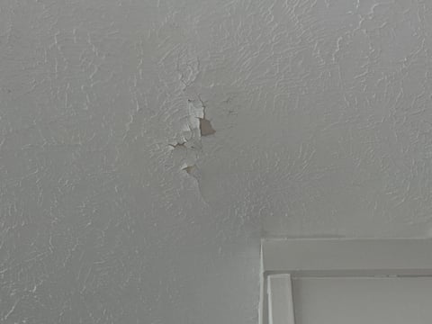 Cracks and breakage on a ceiling inside a office building in Omaha, NE.