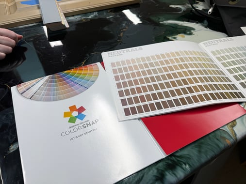 Sherwin Williams color snap and book of neutral paint colors.