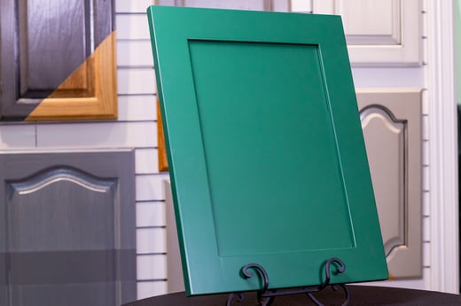 Dark emerald green cabinet door painted with a 2k poly product.