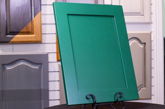 Cabinet door painted with a 2k polyurethane in an emerald green color.