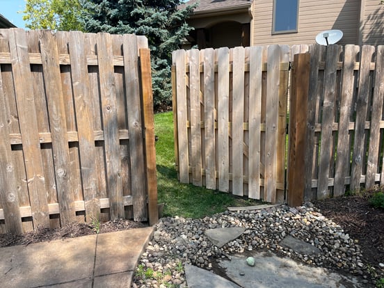 Fence in the process of being stained in Omaha, NE.
