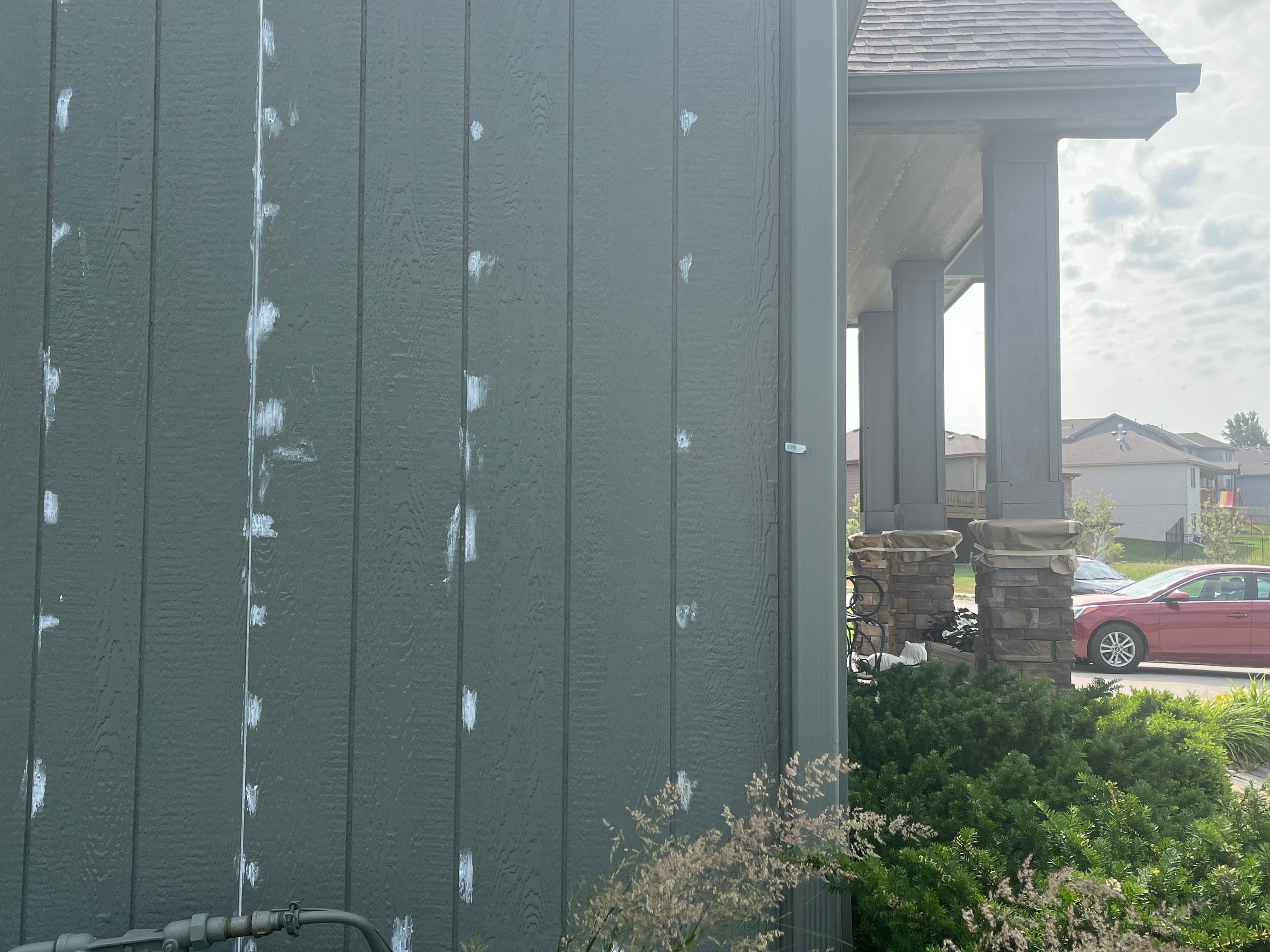 Caulk on the outside of a home before painting in Omaha, NE.