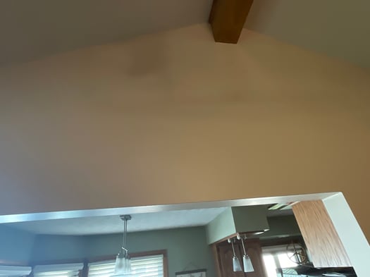 Dark shadow spot at the top of a wall inside a home in Omaha, NE.