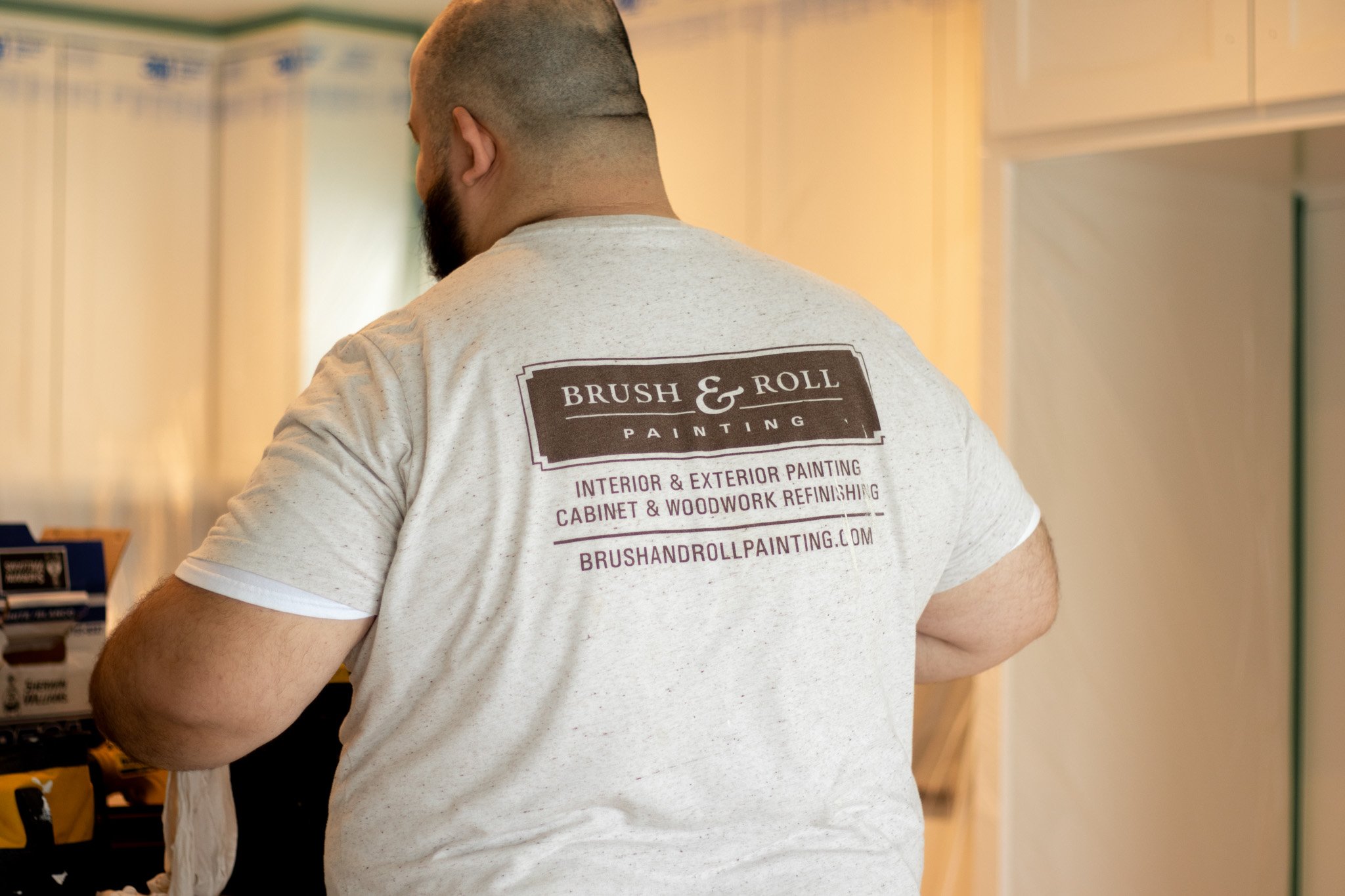 Brush & Roll Painting painter working inside of a home in the Omaha area.