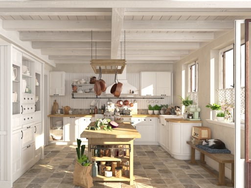 Light wooden freestanding kitchen island in the center of a kitchen with white cabinets.