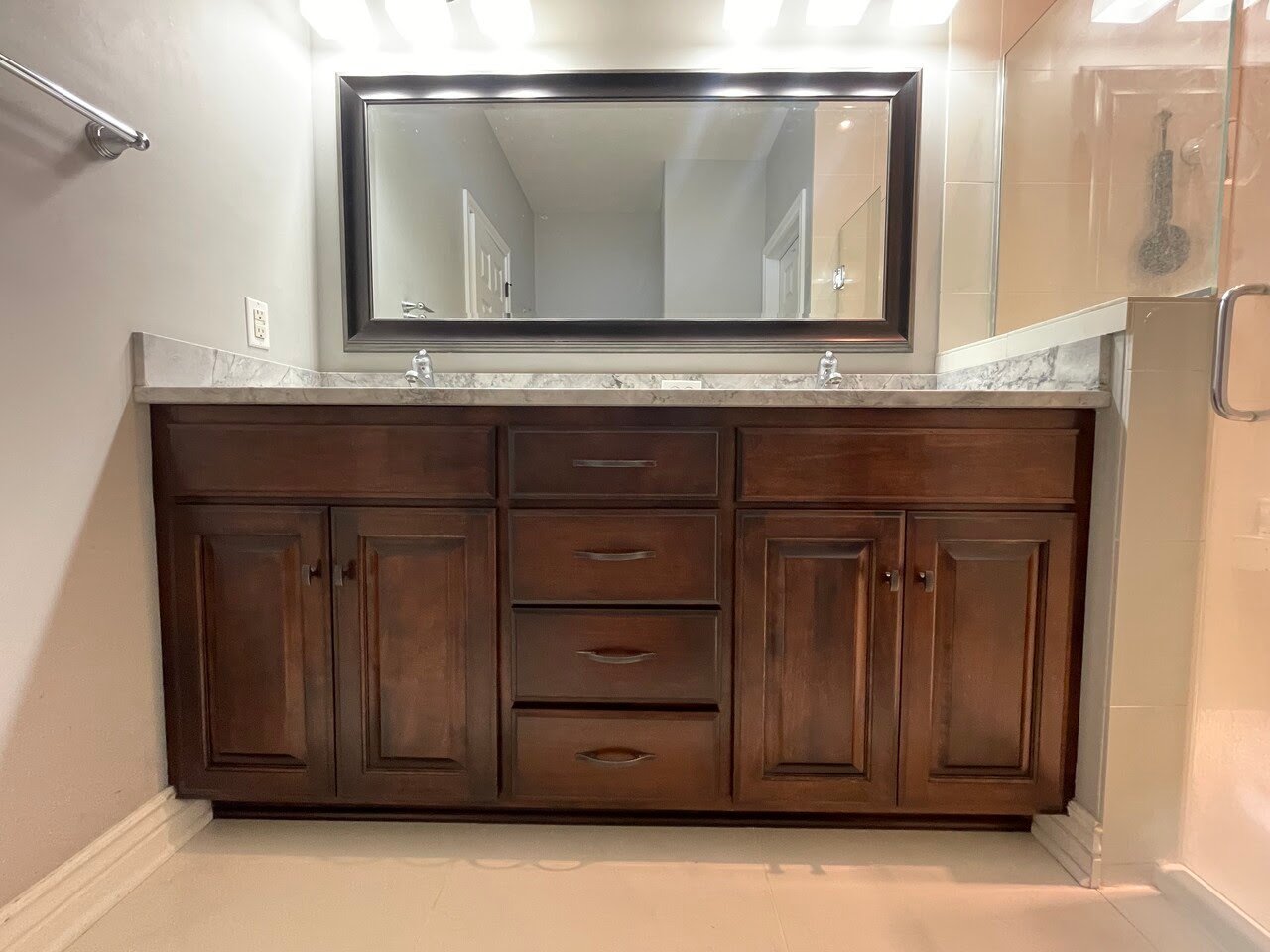 Bathroom cabinet vanity after being stained a dark brown color.