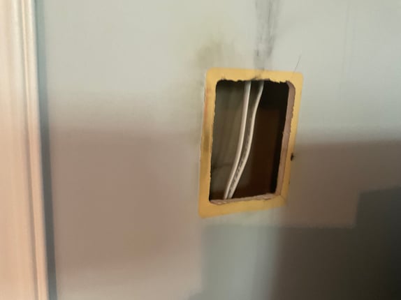 Large hole in drywall that needs repaired.