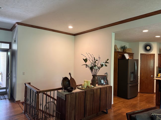 White interior walls with dark brown trim and floors.