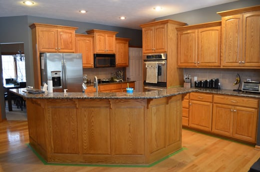 Oak cabinets with blue walls