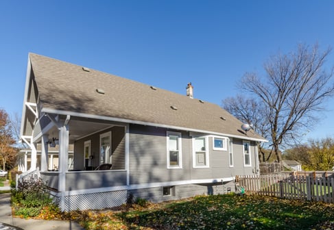 Home painted a light gray with white trim.